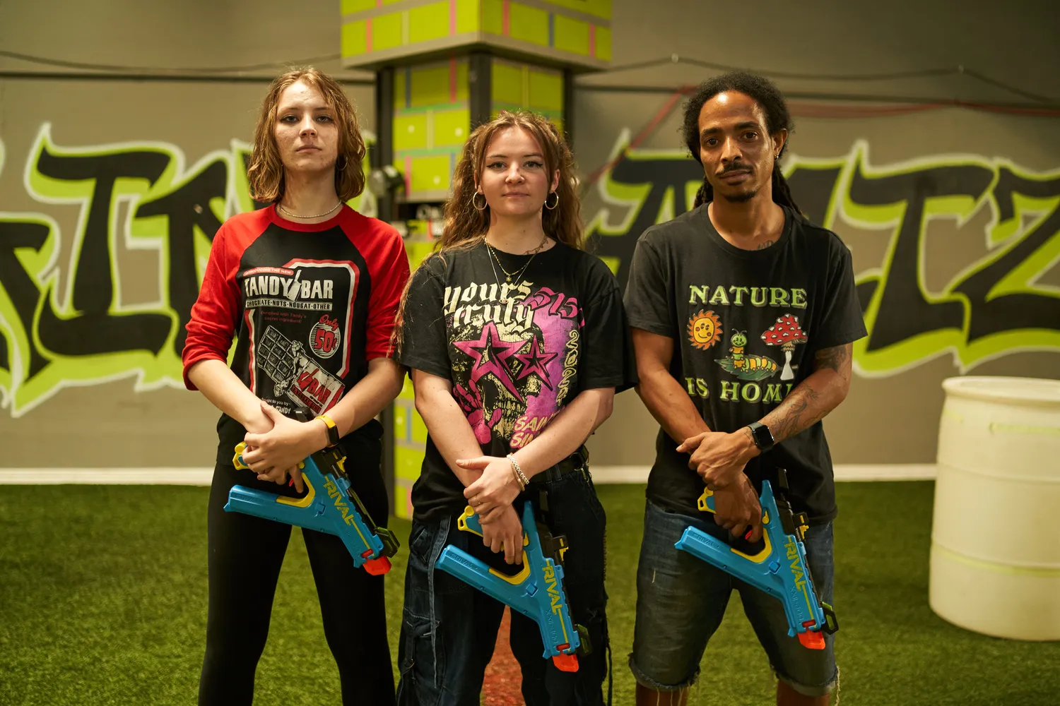 A group of Nerf competitors standing confidently with their blasters, showing sportsmanship and determination in the competition.