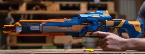 fe5d4f6a 3484 41d6 a8e9 568a7a05f716webp - Brainy Actz Escape Rooms Create a hyper-realistic image of a modern Nerf blaster with a sleek design. The blaster should be colored electric blue, orange, and black, and include simple visible features like a trigger, safety switch, and foam darts in the chamber. Show the blaster either resting on a wooden table or being held by a person's hands. Use natural lighting and a softly blurred background to keep the focus on the blaster.