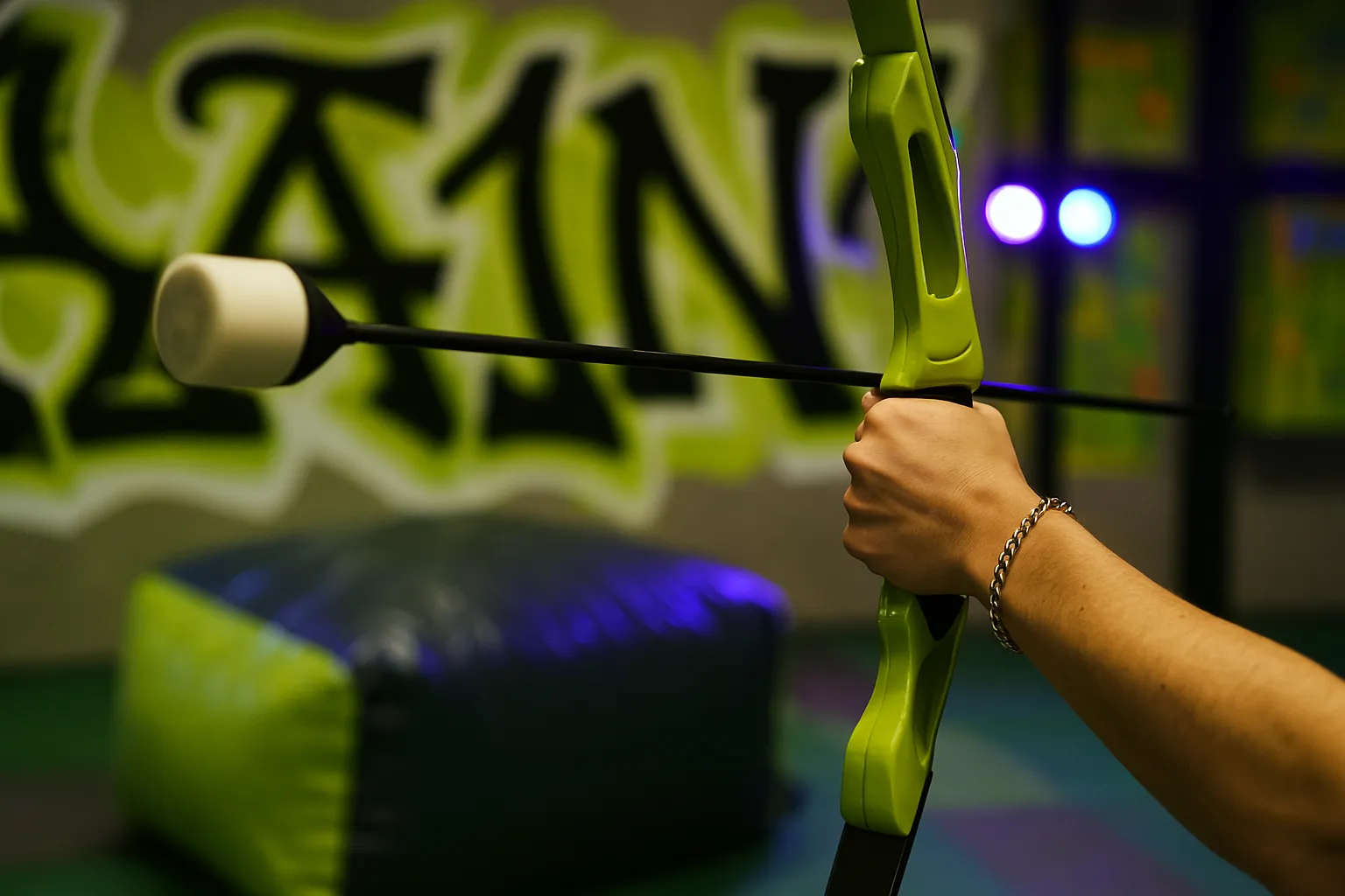 A close-up of a player holding a bow with a foam-tipped arrow, illustrating the type of gear commonly available for rent in archery arrow tag games. - Brainy Actz Escape Rooms A close-up of a player holding a bow with a foam-tipped arrow, illustrating the type of archery arrow tag gear commonly available for rent in archery arrow tag games.