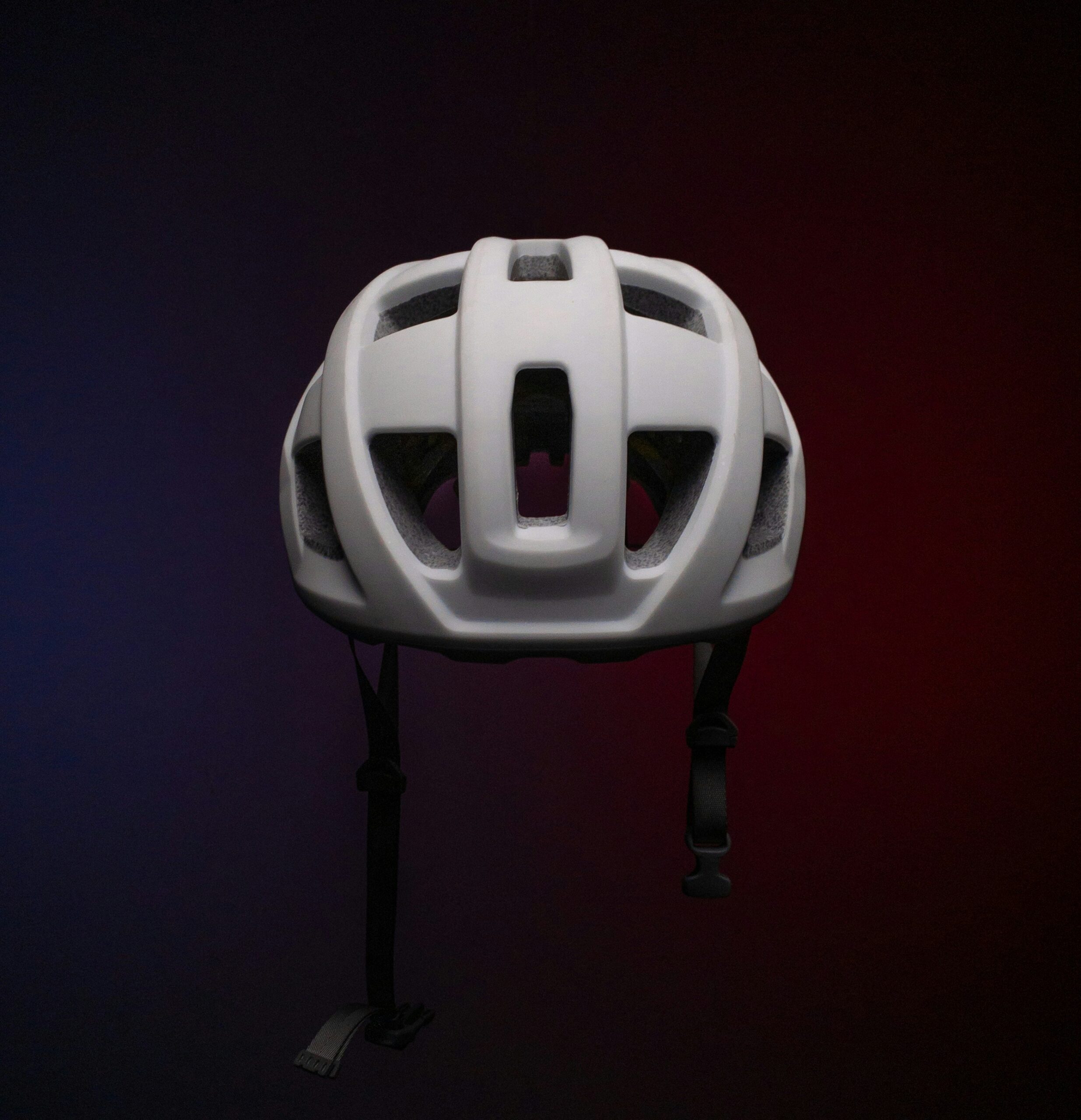 A white protective helmet with ventilation holes and chin straps, showcasing essential headgear for safe arrow tag gameplay. - Brainy Actz Escape Rooms A white protective helmet with ventilation holes and chin straps, showcasing essential headgear for safe arrow tag gameplay.