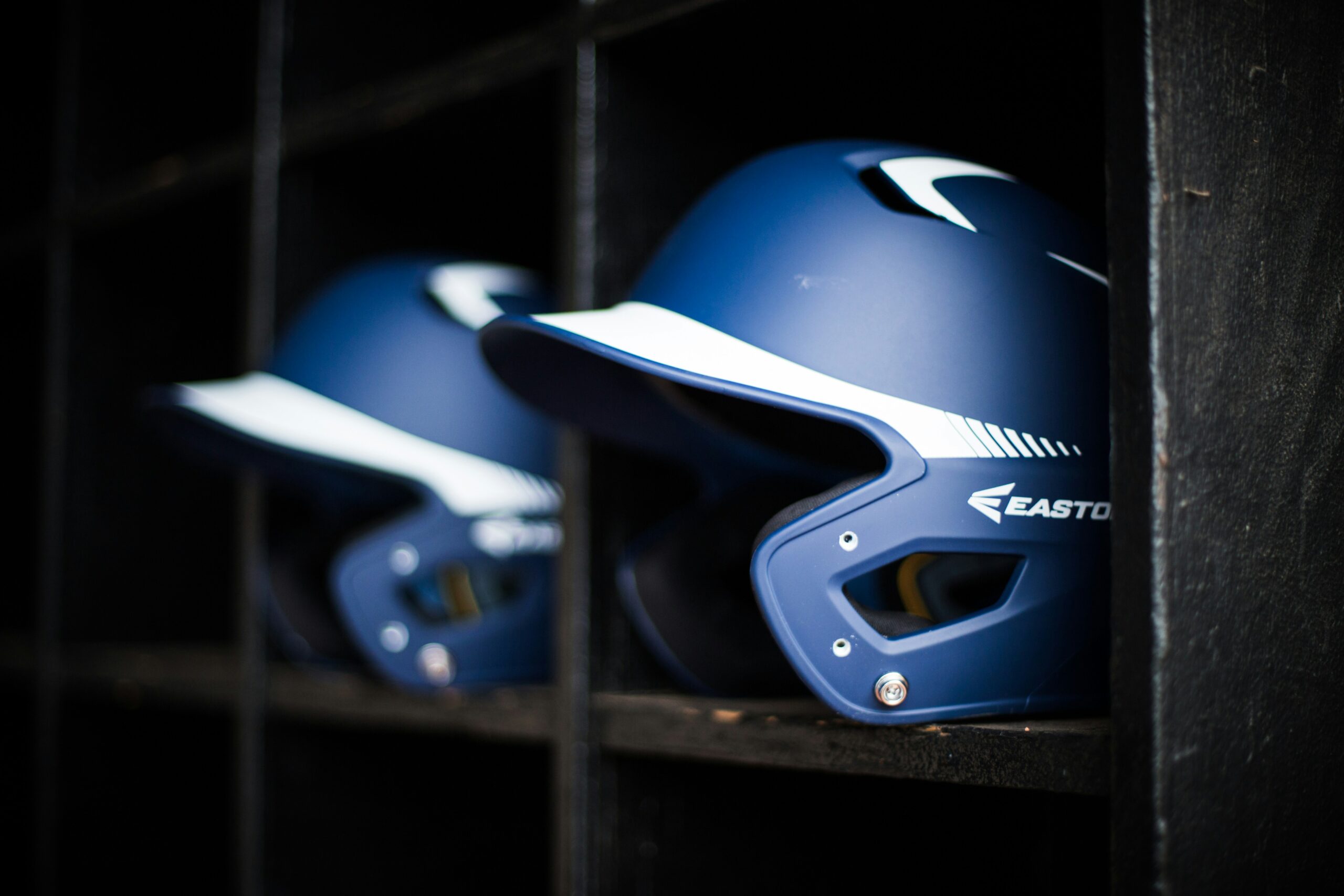 Two protective helmets neatly stored on a shelf, symbolizing readiness and commitment to creating a respectful and safe environment for every participant. - Brainy Actz Escape Rooms Two protective helmets neatly stored on a shelf, symbolizing readiness and commitment to creating a respectful and safe environment for every participant.
