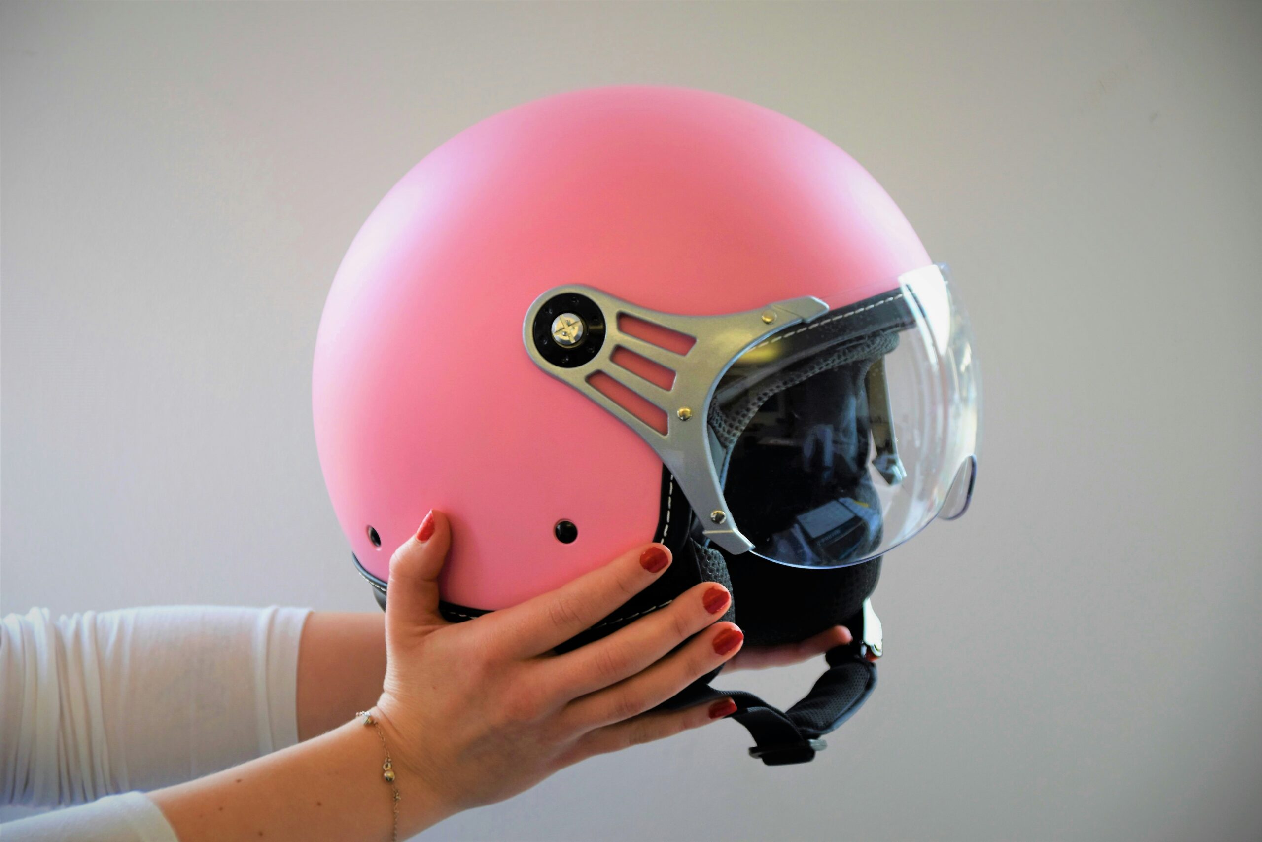 A player holds a protective helmet, highlighting essential arrow tag safety protocols like wearing proper gear during gameplay. - Brainy Actz Escape Rooms A player holds a protective helmet, highlighting essential arrow tag safety protocols like wearing proper gear during gameplay.