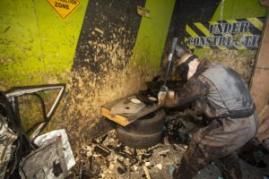 - Brainy Actz Escape Rooms A guy in rage room, smashing objects