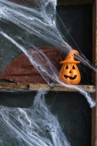 photo 1696511031078 09c7f9e5de77 scaledjpeg - Brainy Actz Escape Rooms haunted house decor with spider webs