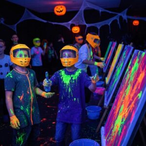 kids and teens enjoying a colorful halloween splatter paint party with neon paints and uv lighting 91cfd9f2 8bb2 4da0 add9 0ec30d57a321webp - Brainy Actz Escape Rooms Kids and teens enjoying a colorful Halloween splatter paint party with neon paints and UV lighting